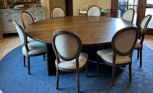 Custom millworks round table with 8 chairs